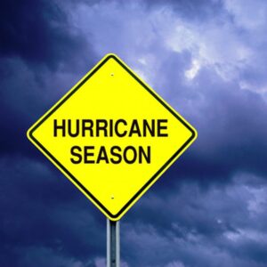 Hurricane Season warning sign against a stormy sky