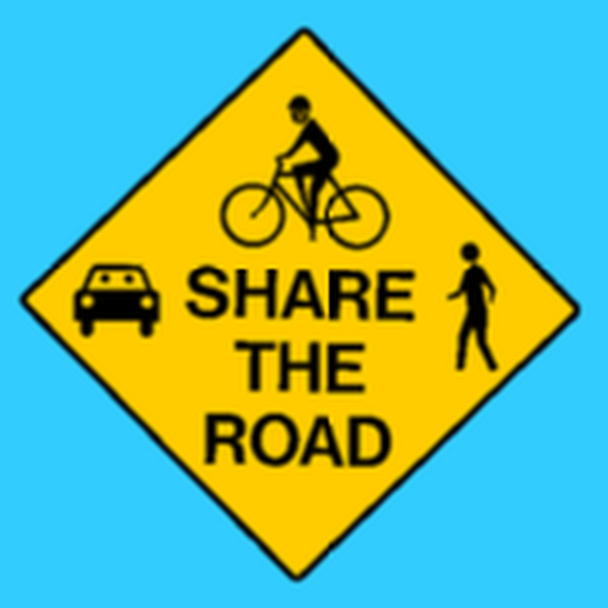 Share the Road sign showing a car, cyclist and pedestrian