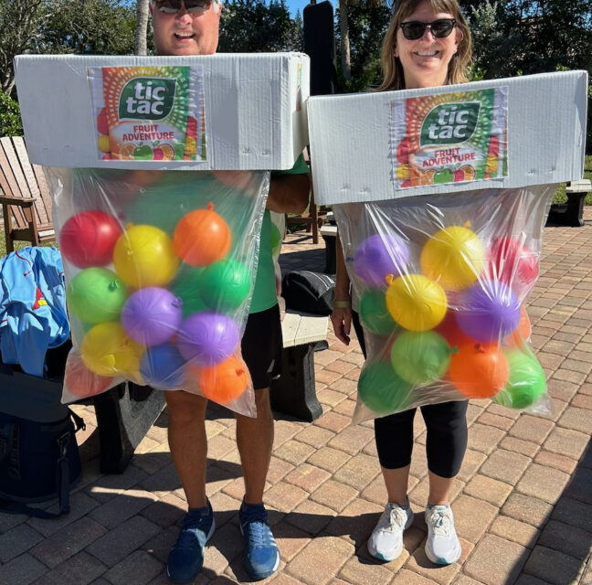 Two residents dressed as Tic Tac boxes at the Marina Halloween event