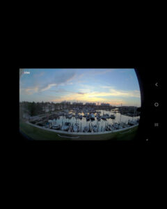 Webcam view of boats in their slips at Burnt Store Marina at dusk